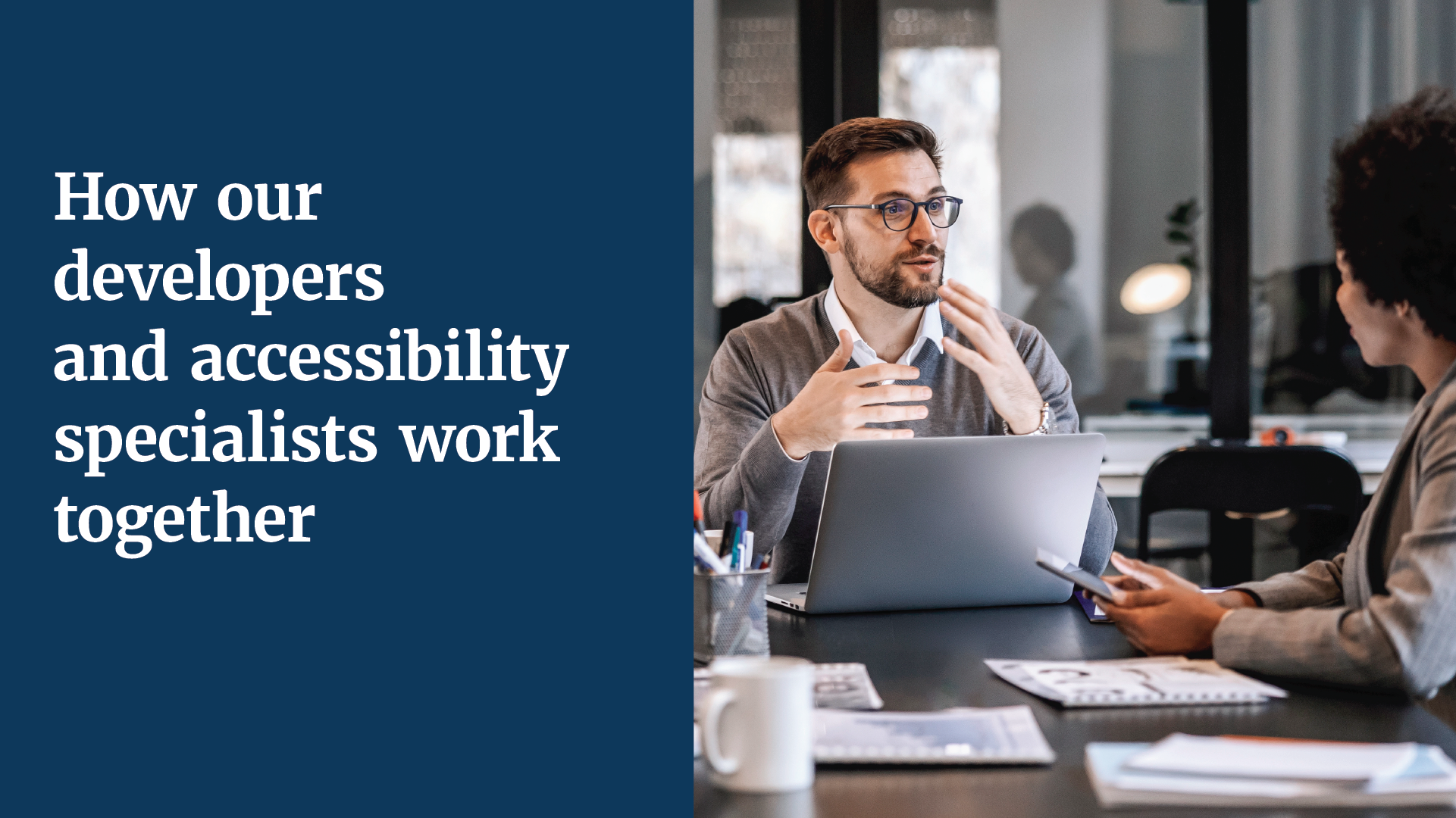 A developer and accessibility specialist talk at an office table next to the text "How our developers and accessibility specialists work together" 