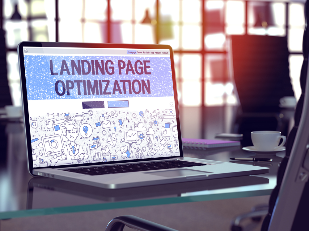 Computer sitting on a desk showing "Landing Page Optimization"